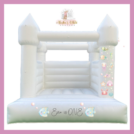 Mockup of pastel under the sea decals with a turtle, jellyfish and seahorse on a white castle pillar and an Evie is ONE decal