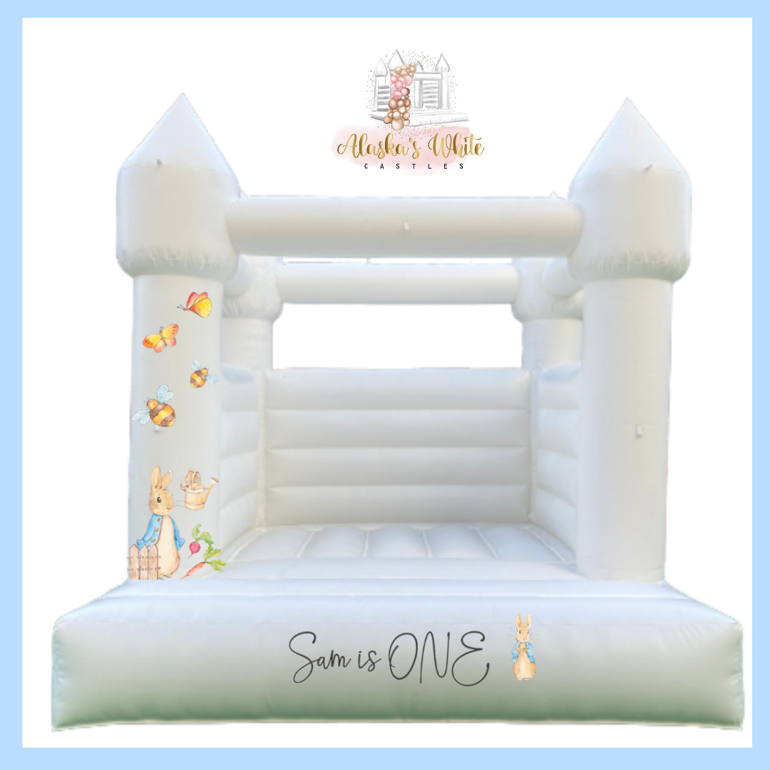 Peter Rabbit decal mockup on a white bouncy castle pillar with butterflies and bees and a Sam is ONE decal on the front step