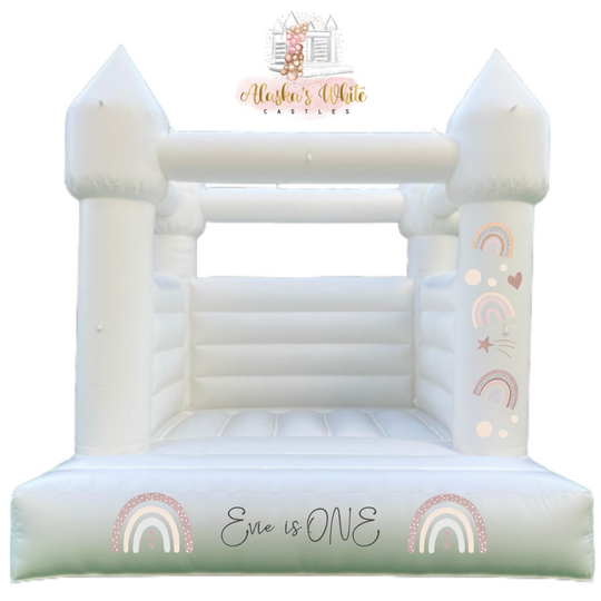 Rainbow boho decal mockup with muted rainbows, hearts and stars on a white bouncy castle pillar and an Evie is ONE front decal